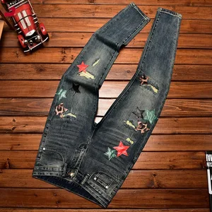 Jeans Fashion High Street Pakaian Musim Gugur dan Musim Dingin Pria Celana Peregangan Skinny Fit Ramping Tambalan Bintang Kepribadian Berlubang & Tambalan